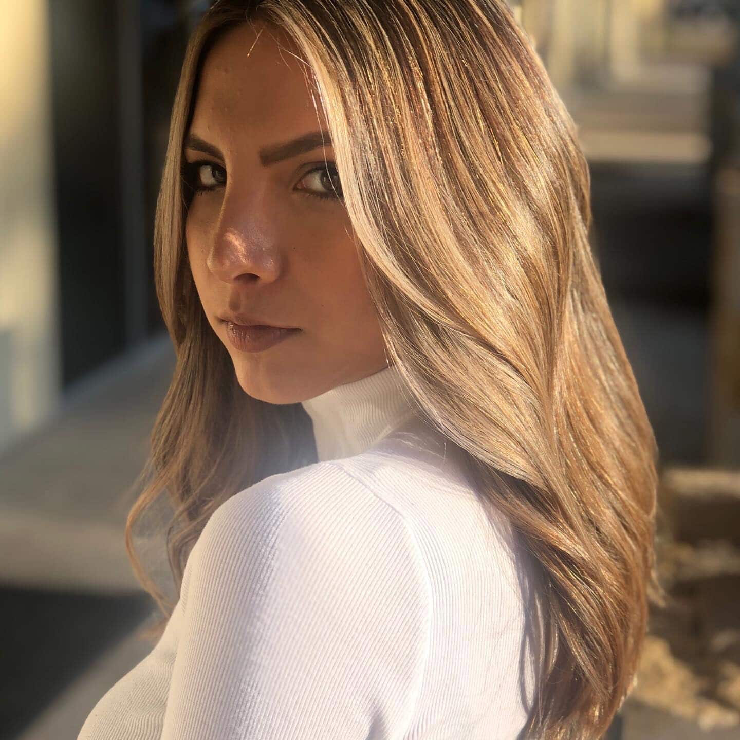 Dimensional brunette colour and long extensions styled in waves by Veronica at Fluff